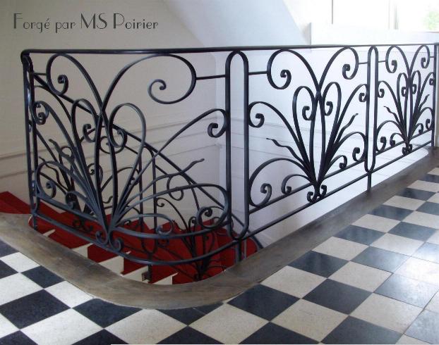 rampe d'escalier en fer forgé créée par Stephan Poirier (ferronnier d'Art)